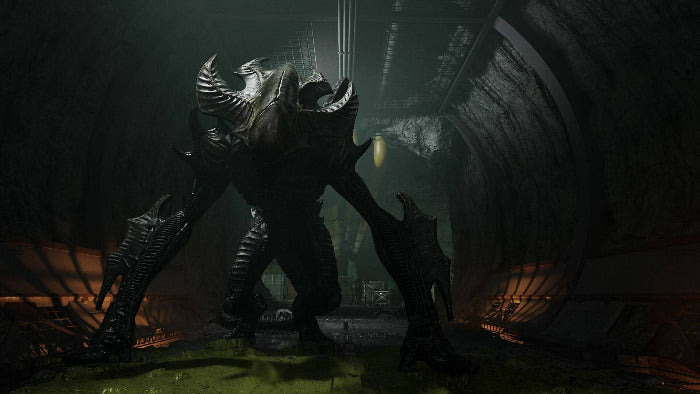 A dark, highly detailed sci-fi creature or monster stands in a dimly lit industrial tunnel or corridor, with glowing orange light on both sides and a yellow light in the background.