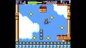 Screenshot of a retro-style video game with a character and enemies on a platform.