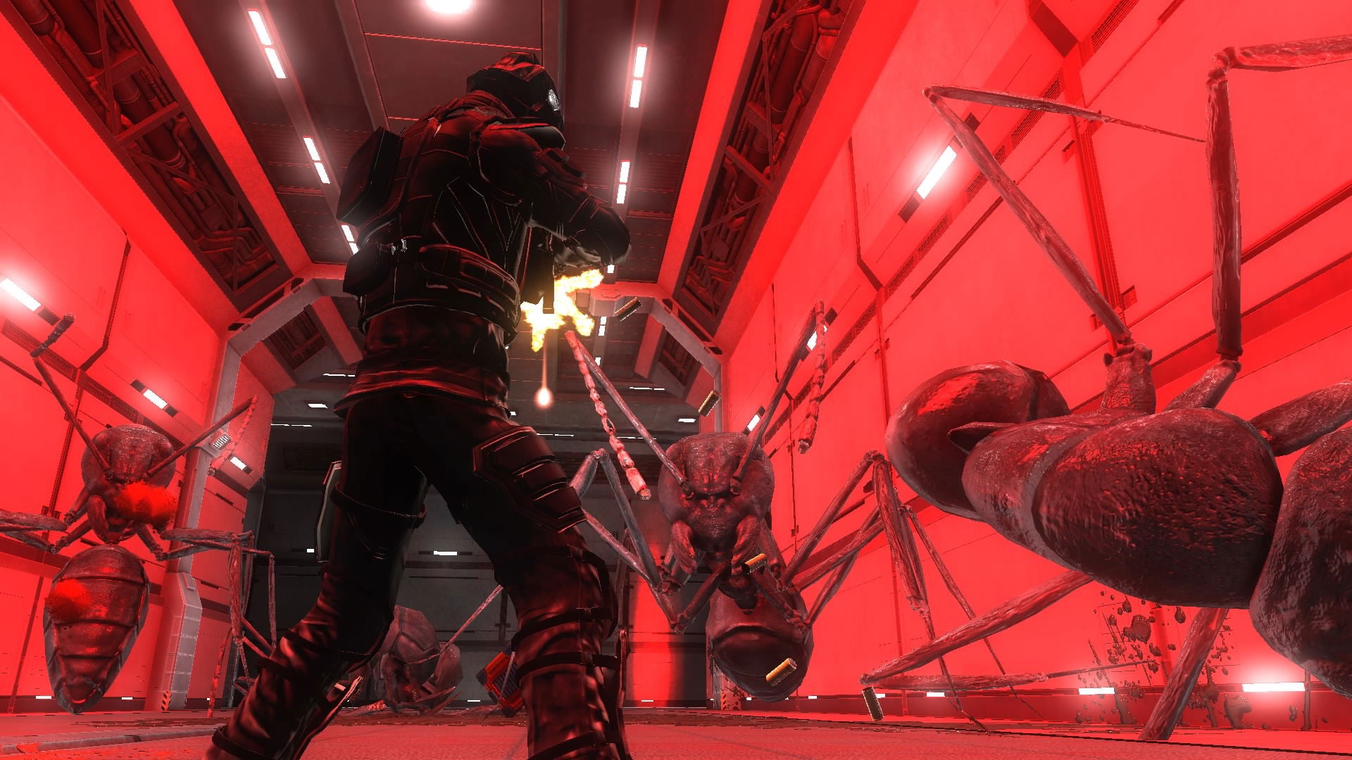 A dark sci-fi scene with a person in black armor standing in a red-lit industrial corridor, facing large spider-like creatures.