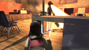 First-person perspective of a player in a virtual environment with a gun and table.