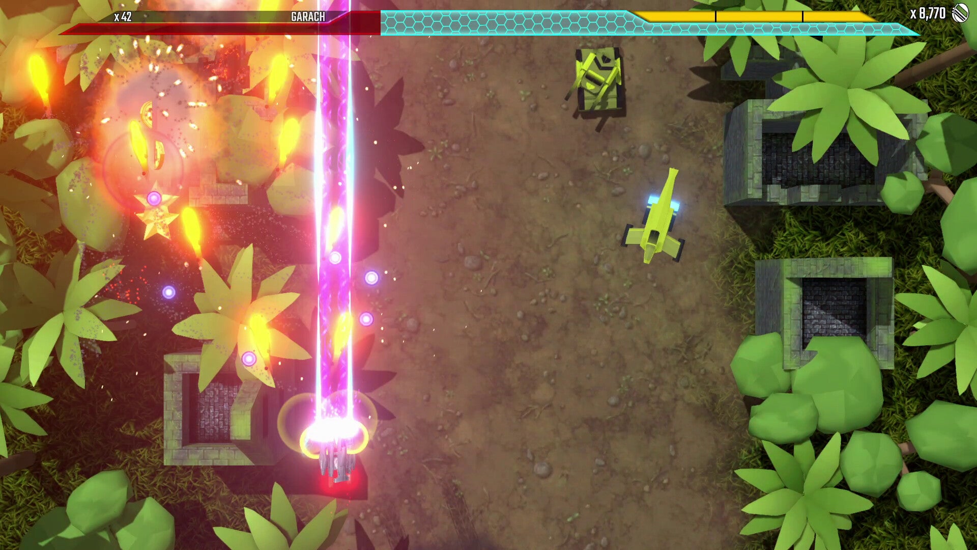 Top-down view of a video game scene with characters and vibrant effects in a forest setting.
