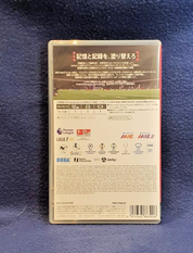 Back cover of a Japanese video game case for Football Manager 2024, photographed flat on a dark blue textured fabric background.