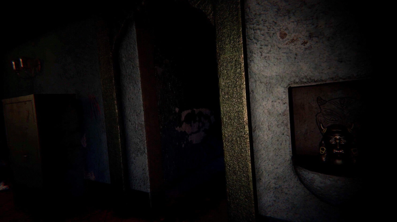 A dark, atmospheric scene showing a dimly lit interior with a doorway, textured walls, and a small framed object on the right wall.