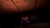 A low-angle shot from beneath a bed, showing a person in a white dress peeking out from the dark space underneath.