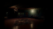 A dark, atmospheric interior room with a low hanging chandelier, a patterned rug on the floor, and a faint light source on the back wall.