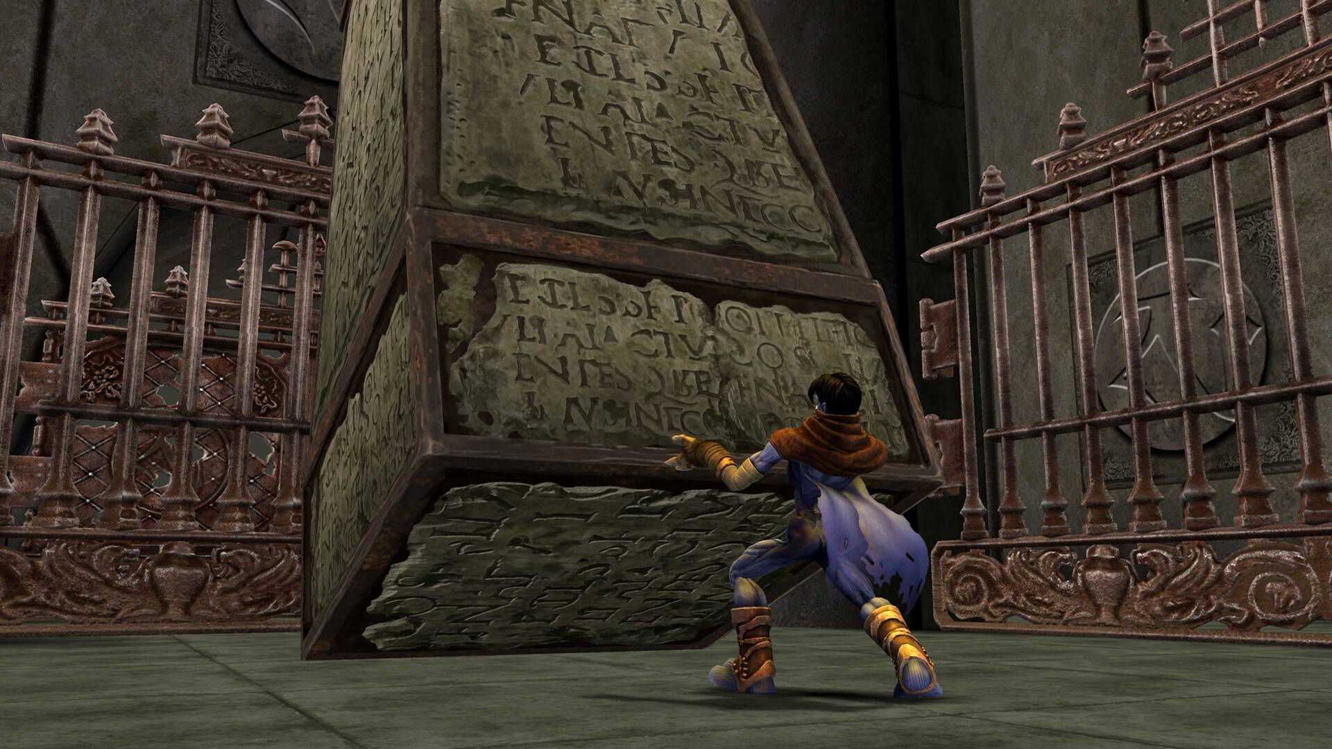 A video game scene showing a small character in a blue and purple outfit pushing a large stone pyramid with ancient carvings in a stone chamber with ornate metal gates.