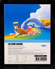 Back of a PlayStation 5 game case for Shinsegae's DreamMotion PICO-8 software, featuring a colorful illustration of a corgi on a rainbow hill with a halo, on a black background.