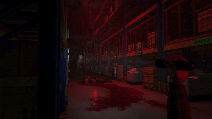 A dark, atmospheric warehouse scene with red lighting, a blood-splattered floor, shelving, and a partially visible person in the right foreground holding a camera.