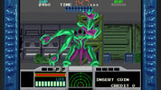 Vintage video game screen with a green alien character and coin insertion prompt.