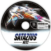 A circular game disc for 'Satazius Next' featuring a colorful futuristic spaceship with glowing blue, orange, and red light effects against a black space background. The title 'SATAZIUS NEXT' is prominently displayed in large blue and white text at the bottom, along with publisher and platform logos including PlayStation, Dreamcast, and Astro Port.