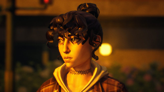 A close-up portrait of a woman with dark curly hair in a bun, wearing a brown plaid jacket over a beige hoodie and a black choker necklace, set against a warm, dimly lit background.