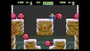 Screenshot of a classic platformer game with characters and obstacles on a snowy level.