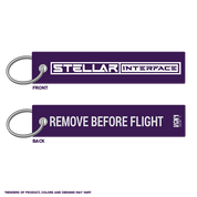Purple keychain with 'Stellar Interface' on one side and 'Remove Before Flight' on the other, on a white background.