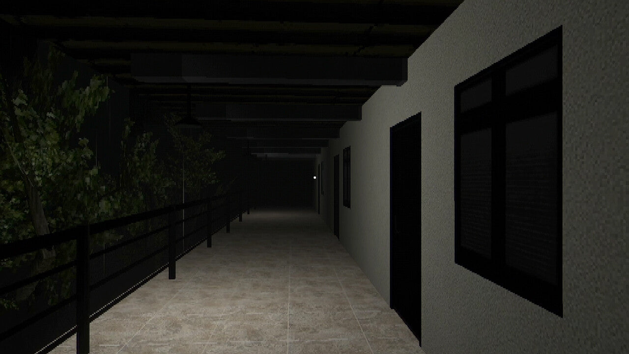 Dark hallway with railing on the left and windows on the right wall.