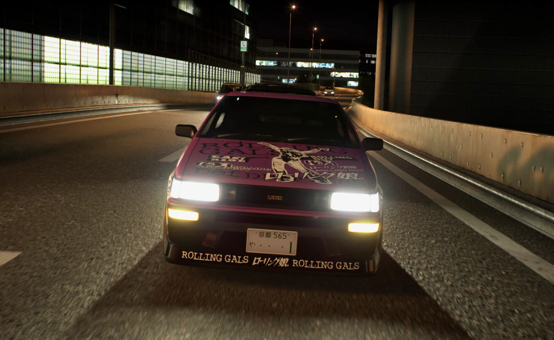 Car on a highway at night with visible branding
