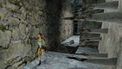 Character in a video game setting with stone walls and steps