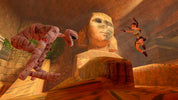 Video game scene with a character leaping over a mummy towards a sphinx.