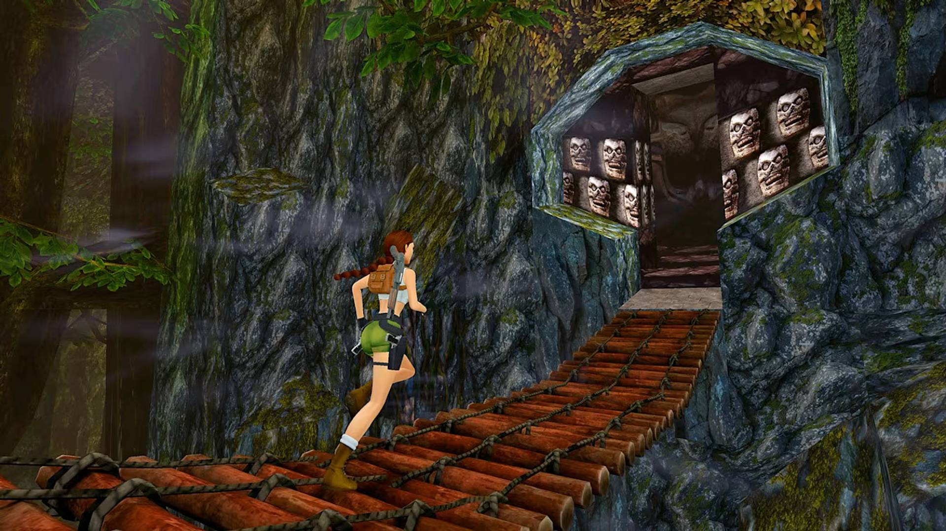 Video game character running along a bridge with a cave entrance in the background