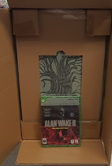 Box of 'Alan Wake II' game with a tree design on the cover.
