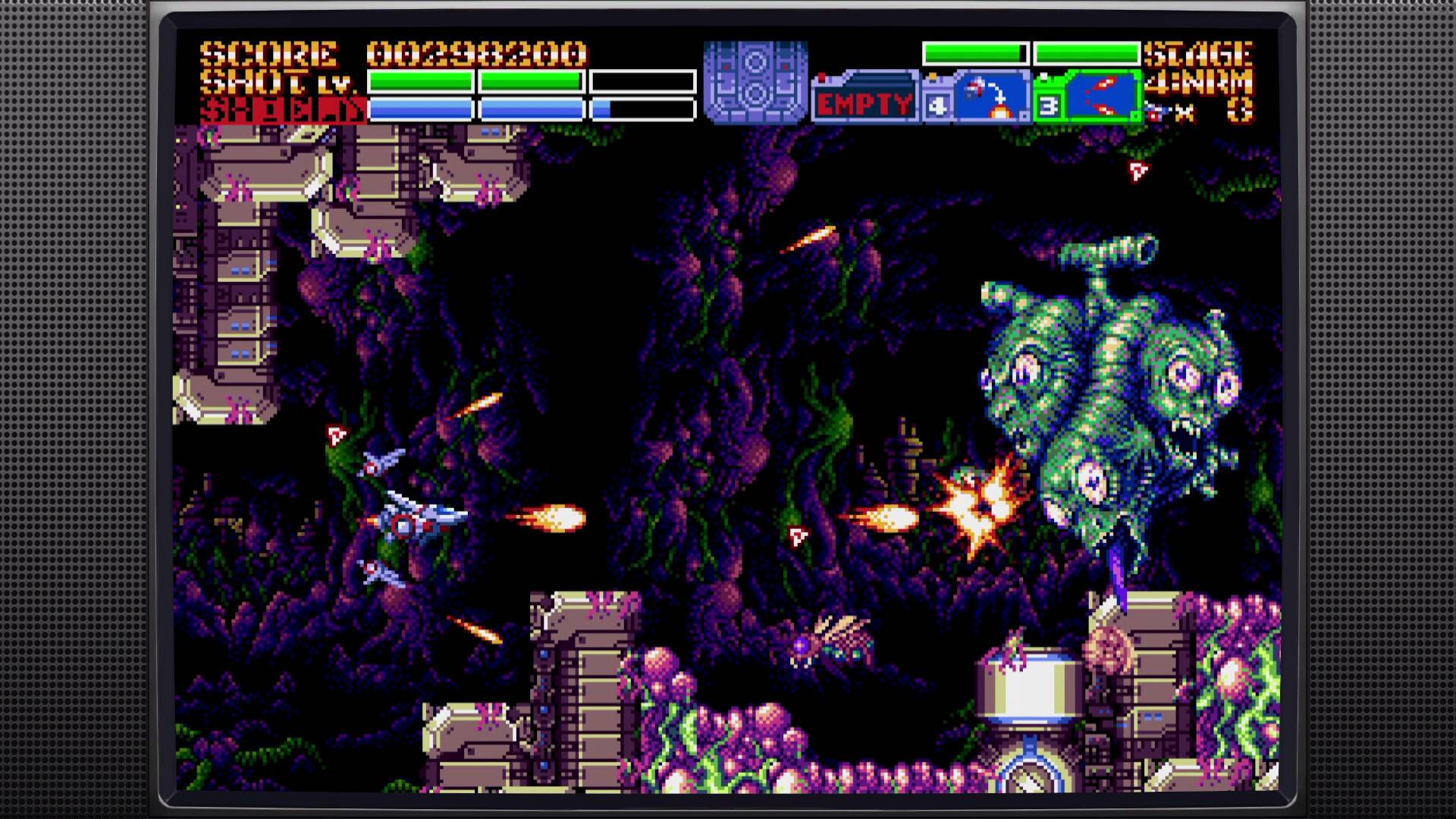 Vintage video game screen with a space shooter scene featuring alien creatures and explosions.